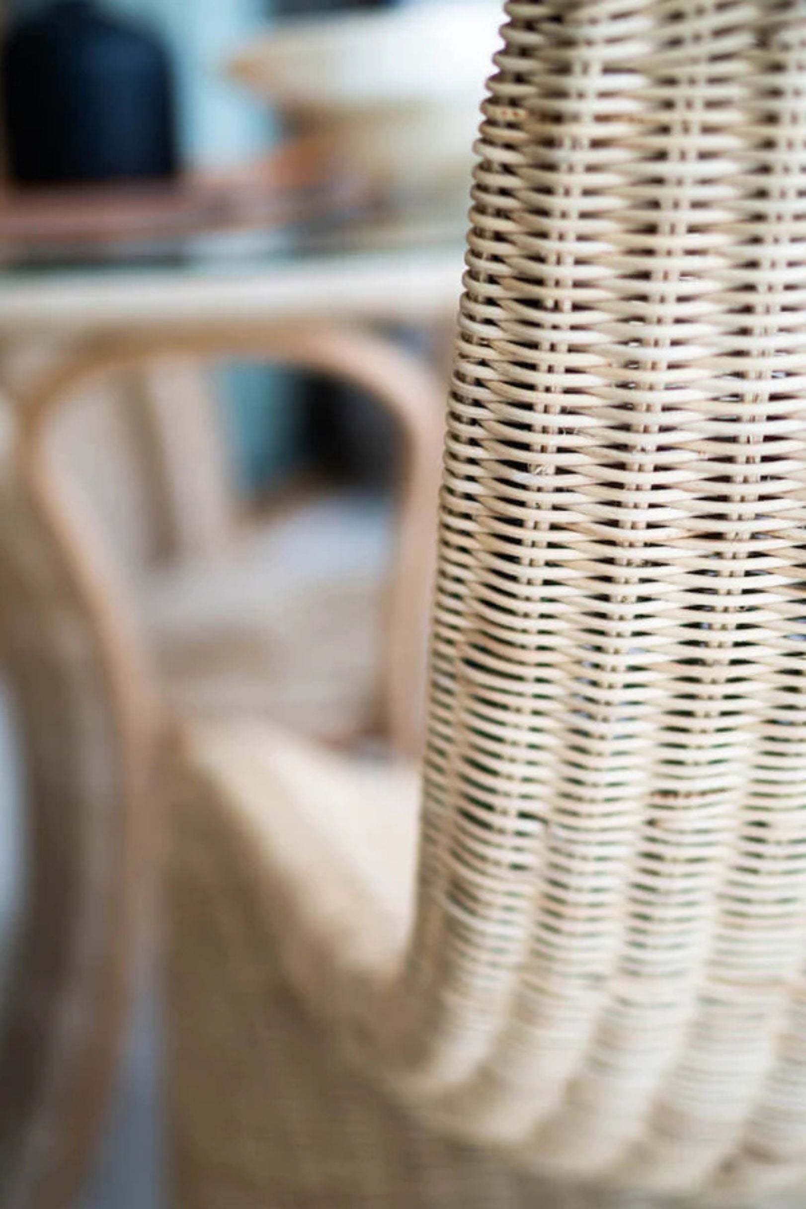 Oriana Collection handmade rattan chair with modern curved design, unique craftsmanship