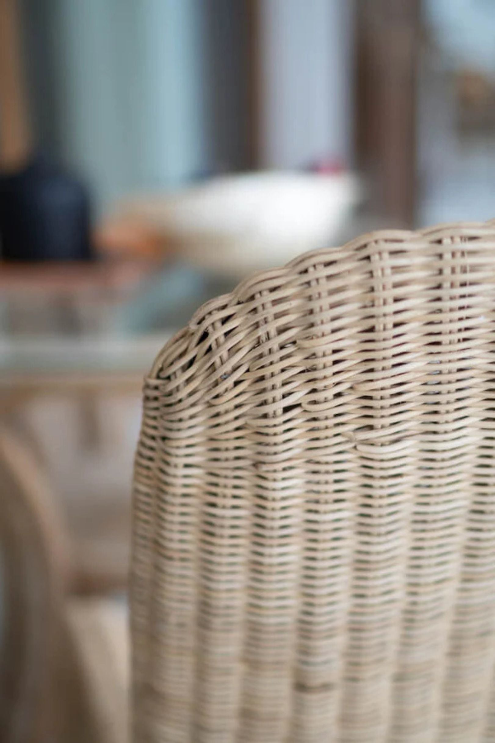 Oriana Collection handmade rattan chair with modern curved design, unique craftsmanship