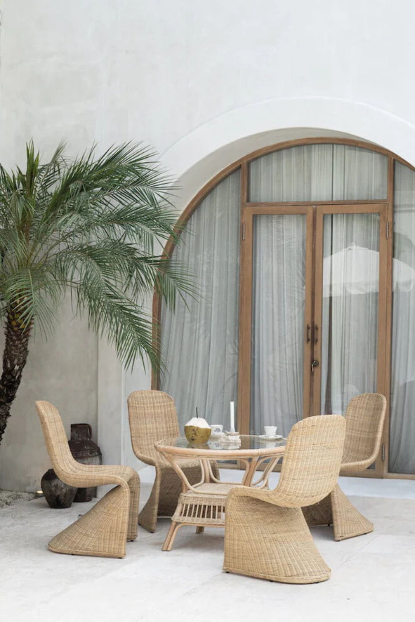 Oriana Collection handmade rattan chair with modern curved design, unique craftsmanship