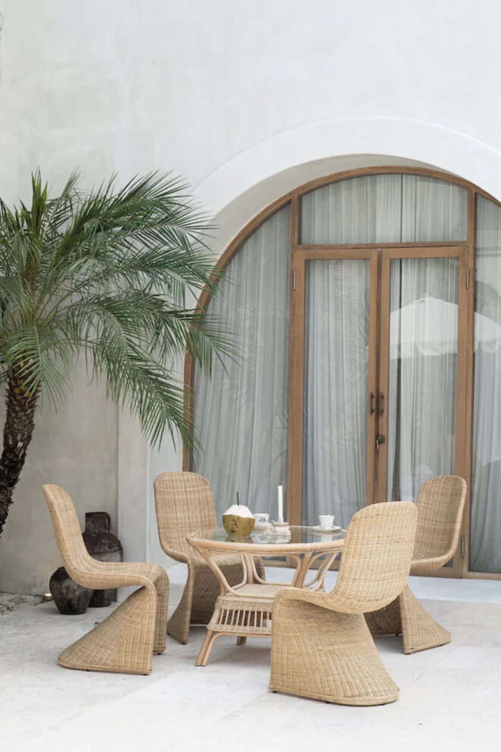 Oriana Collection handmade rattan chair with modern curved design, unique craftsmanship