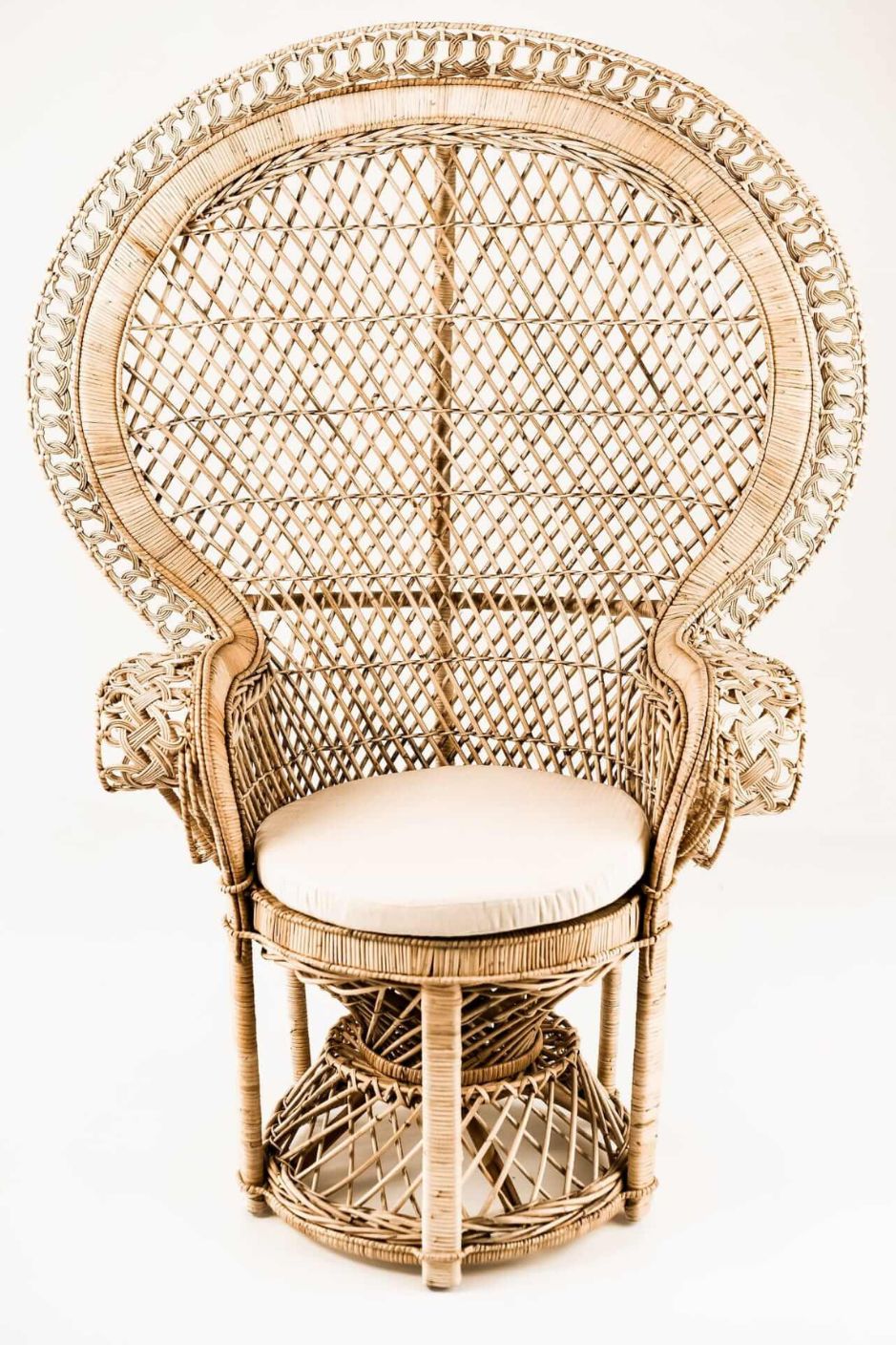 Peacock rattan chair with high back and cream cushion, handcrafted from natural rattan, perfect oversized boho accent for indoor or covered outdoor spaces