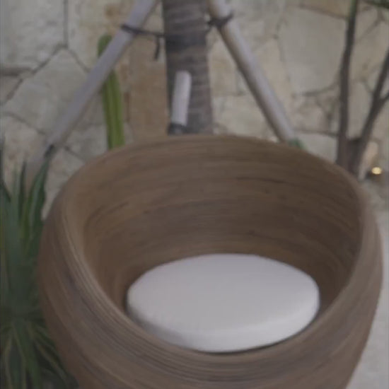 Handmade rattan armchair in dark brown with boho style, perfect for cozy living spaces