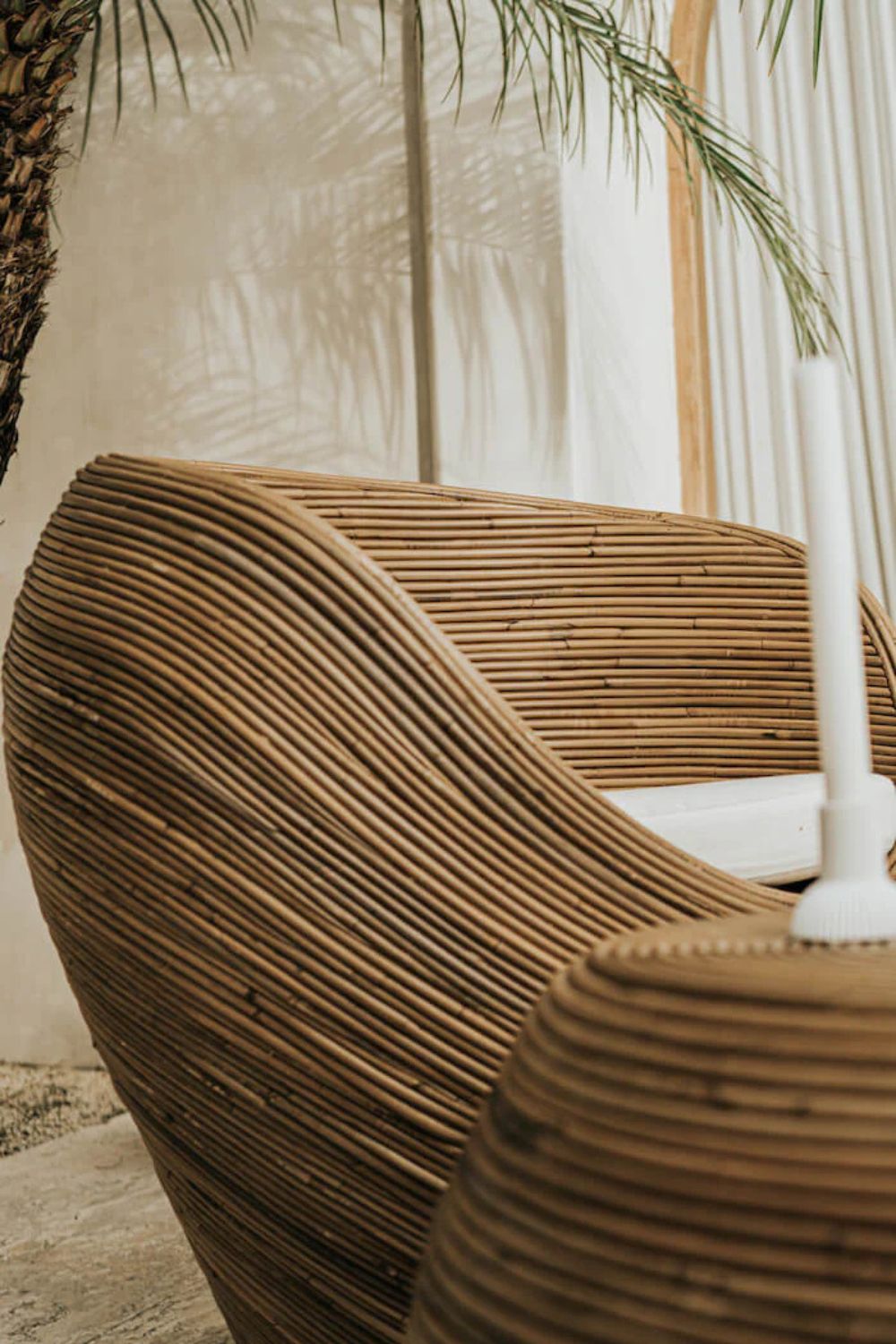 Handmade rattan armchair in dark brown with boho style, perfect for cozy living spaces