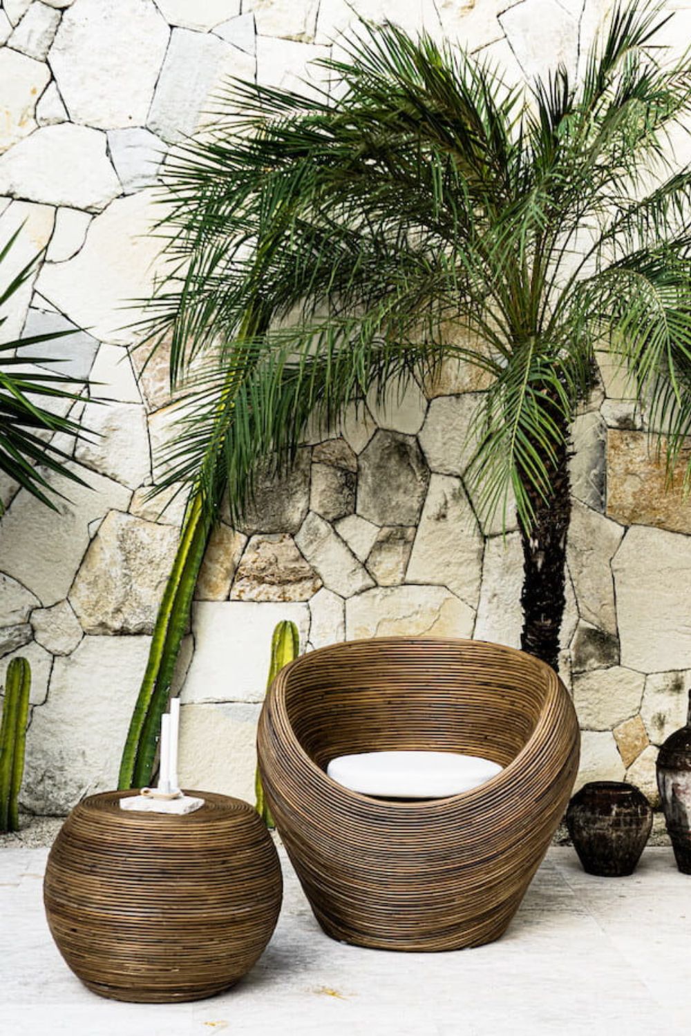 Handmade rattan armchair in dark brown with boho style, perfect for cozy living spacesx