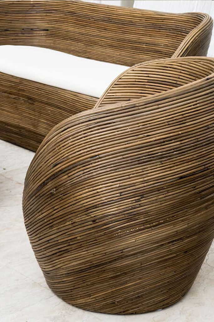 Handmade rattan armchair in dark brown with boho style, perfect for cozy living spaces