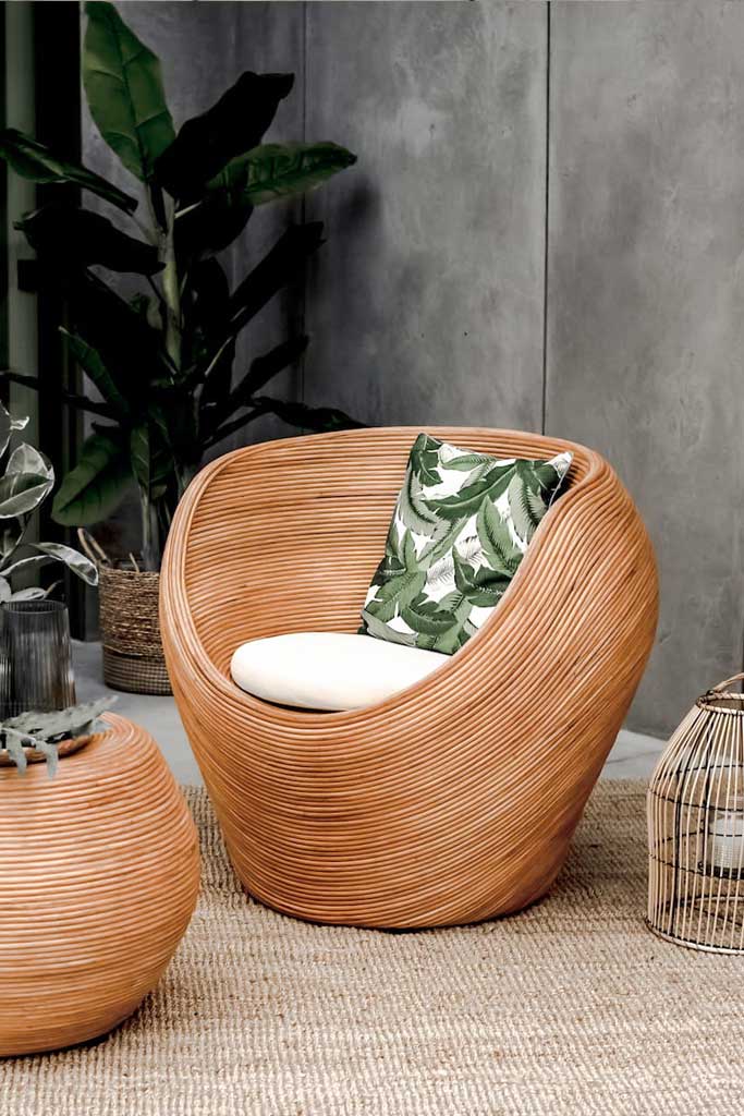 Handmade rattan armchair in cognac brown with boho style, perfect for cozy living spaces