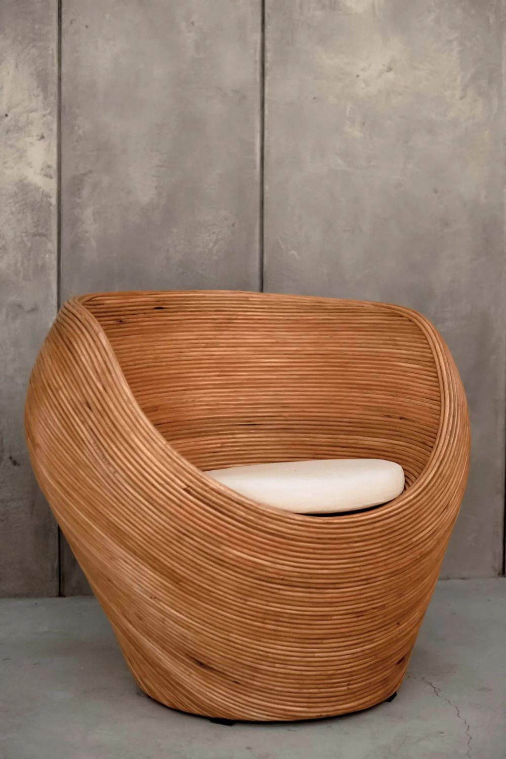 Handmade rattan armchair in cognac brown with boho style, perfect for cozy living spaces