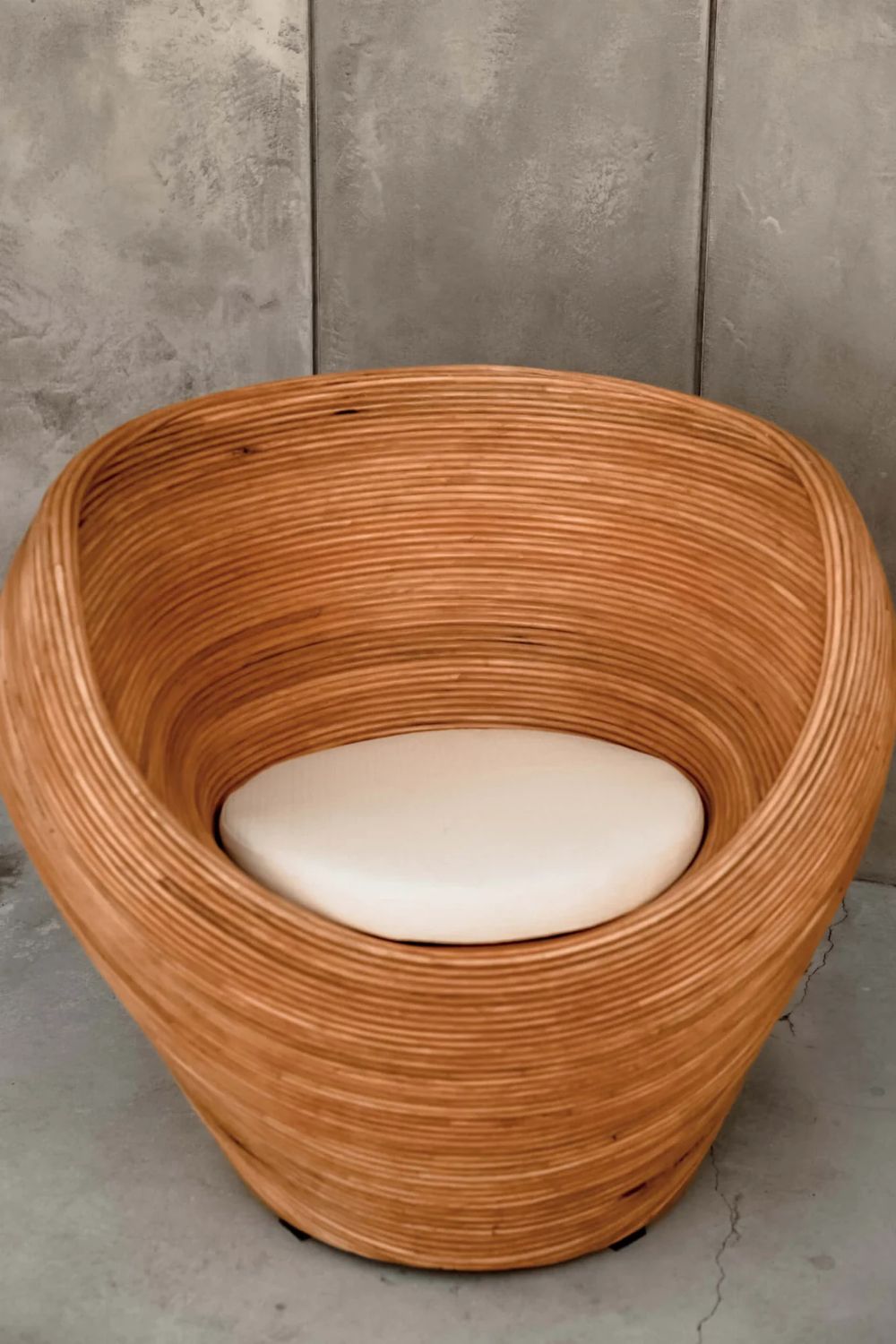 Handmade rattan armchair in cognac brown with boho style, perfect for cozy living spaces