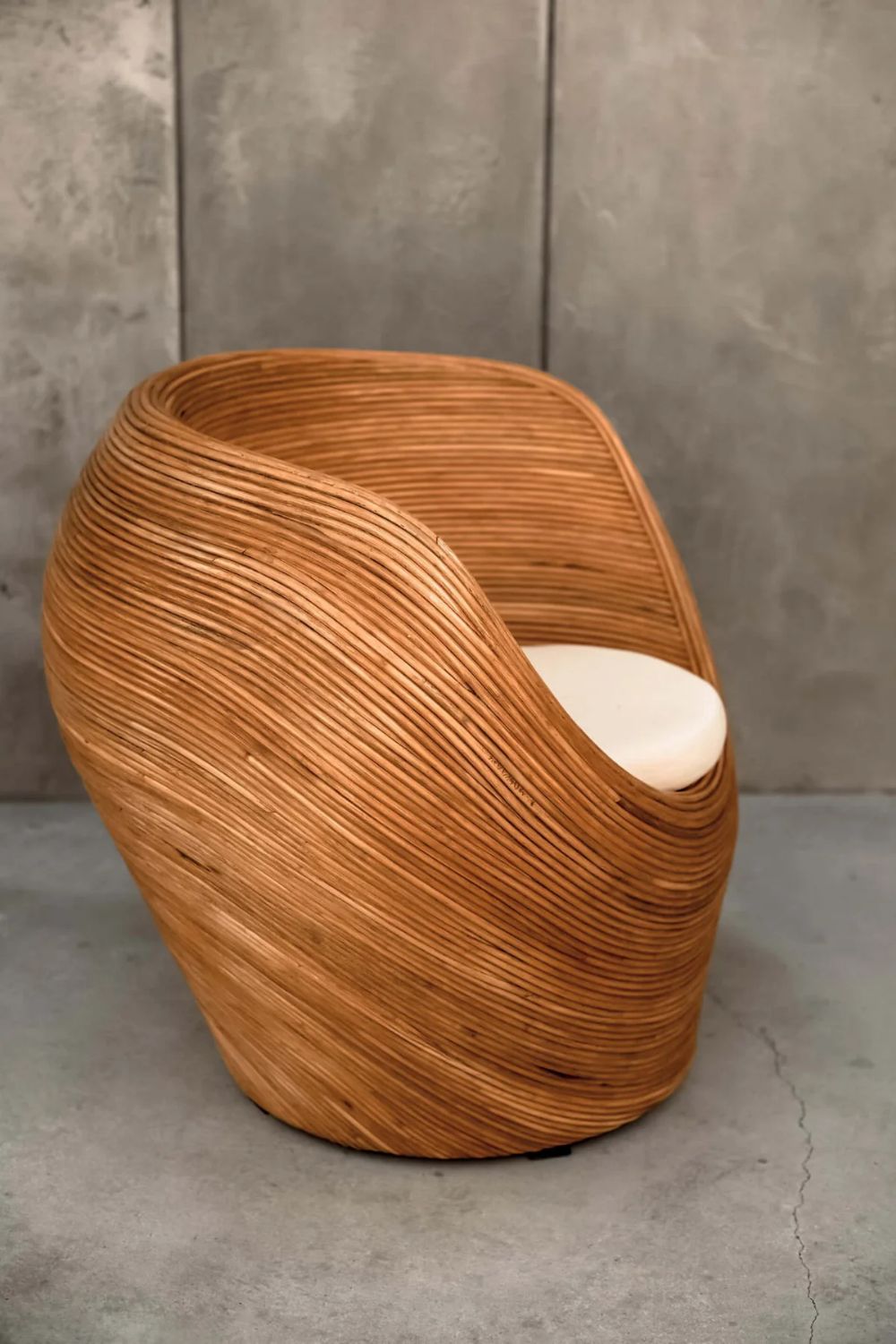 Handmade rattan armchair in cognac brown with boho style, perfect for cozy living spaces