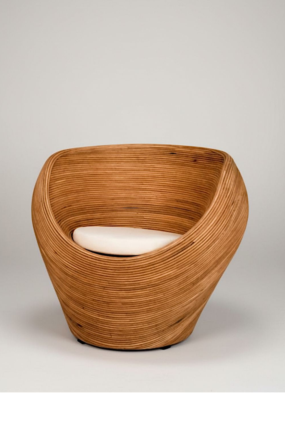 Handmade rattan armchair in cognac brown with boho style, perfect for cozy living spaces