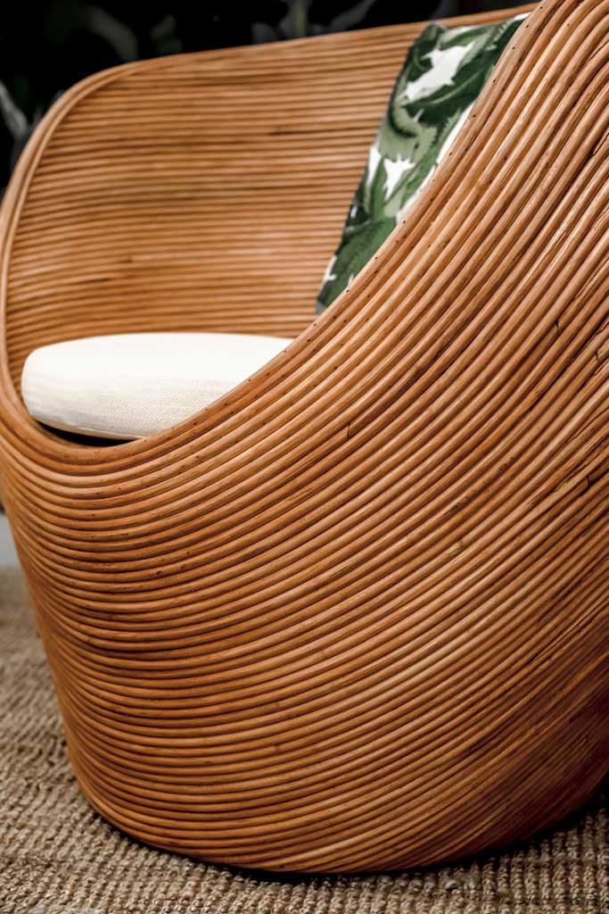 Handmade rattan armchair in cognac brown with boho style, perfect for cozy living spaces