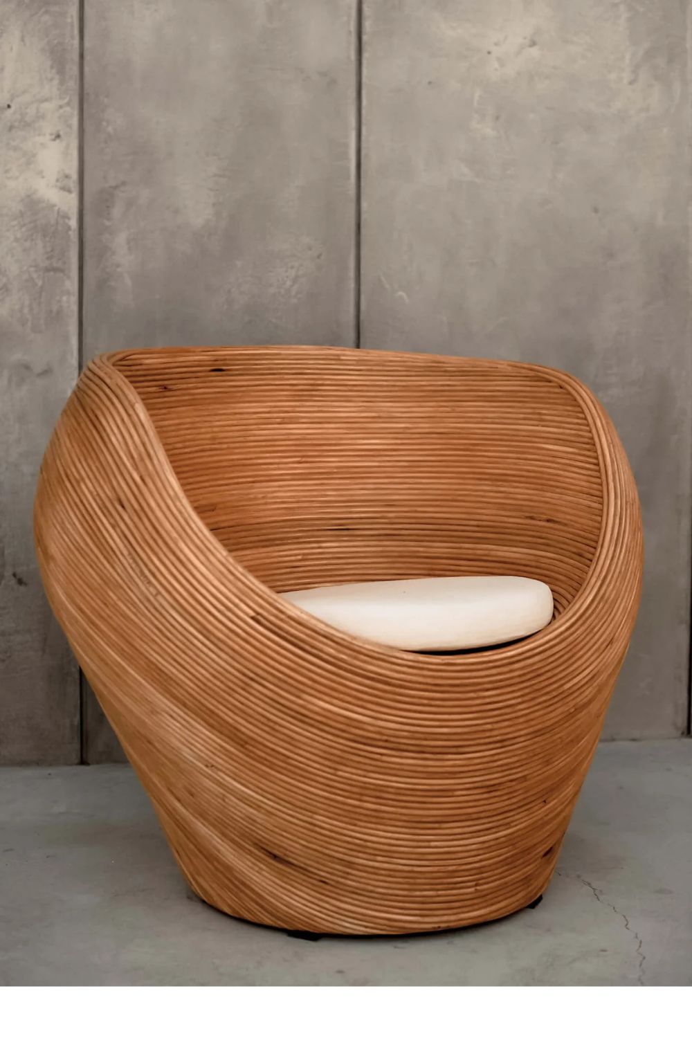 Handmade rattan armchair in cognac brown with boho style, perfect for cozy living spaces