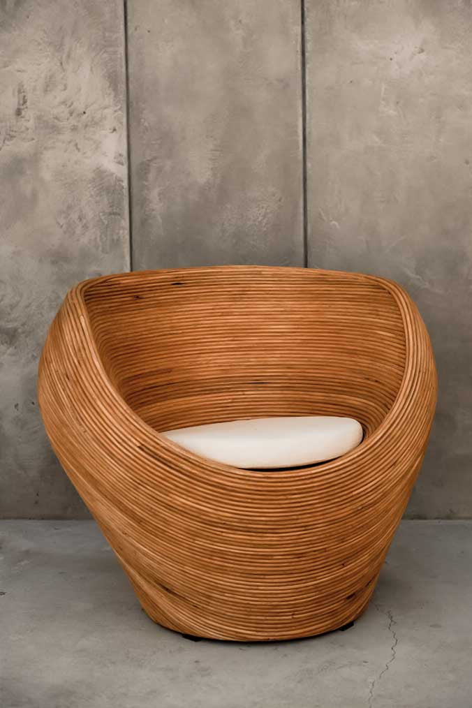 Handmade rattan armchair in cognac with boho style, perfect for cozy living spaces
