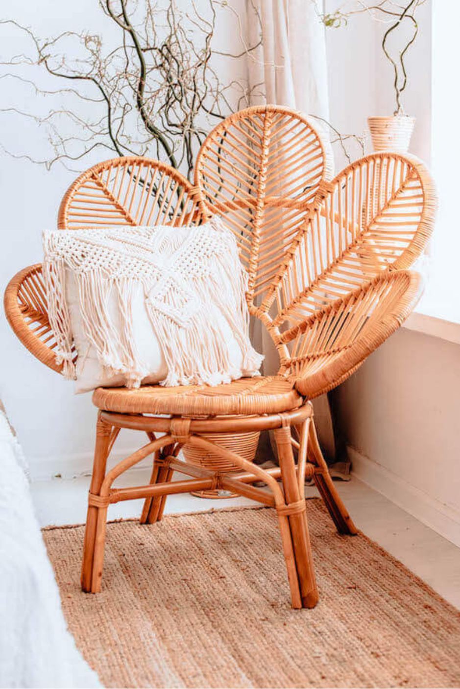 Rattan Monna Flower Chair featuring a handcrafted petal-shaped backrest and natural rattan weave, offering elegant bohemian style for indoor or outdoor spaces