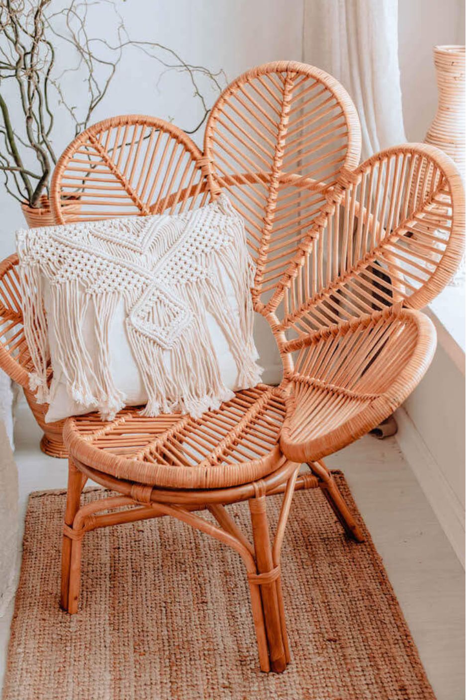 Rattan Monna Flower Chair featuring a handcrafted petal-shaped backrest and natural rattan weave, offering elegant bohemian style for indoor or outdoor spaces