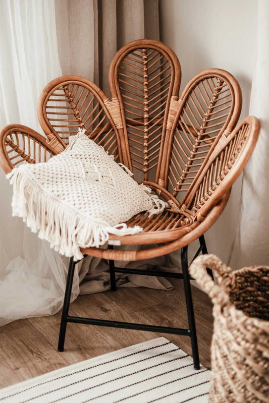 Rattan Sia Flower Chair in warm cognac finish - handcrafted bohemian furniture featuring a petal-shaped backrest and natural rattan weave, perfect for living rooms or patios