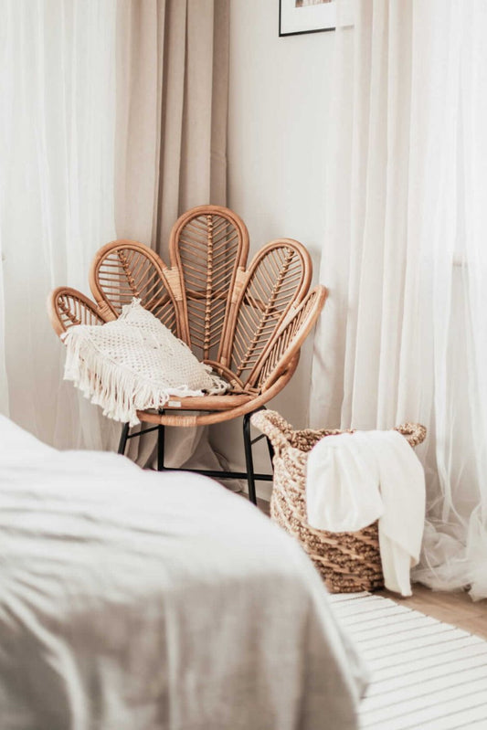 Rattan Sia Flower Chair in natural finish - handcrafted bohemian furniture with a petal-shaped backrest and woven rattan design, ideal for living rooms, bedrooms, or outdoor spaces