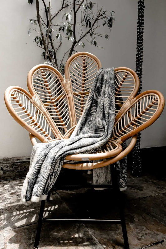 Rattan Sia Flower Chair in natural finish - handcrafted bohemian furniture with a petal-shaped backrest and woven rattan design, ideal for living rooms, bedrooms, or outdoor spaces
