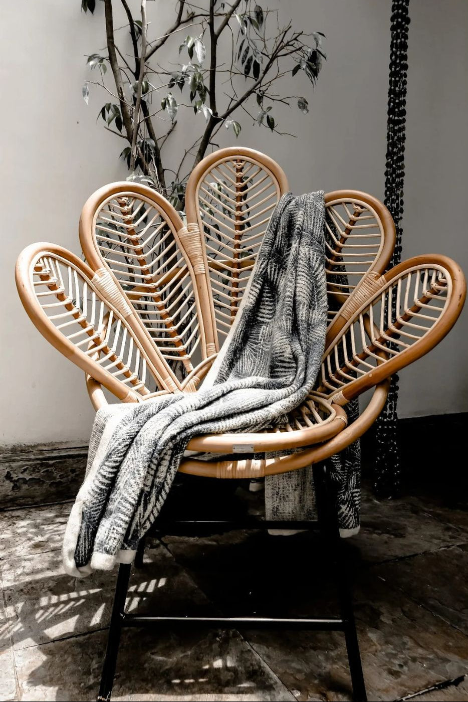 Rattan Sia Flower Chair in natural finish - handcrafted bohemian furniture with a petal-shaped backrest and woven rattan design, ideal for living rooms, bedrooms, or outdoor spaces
