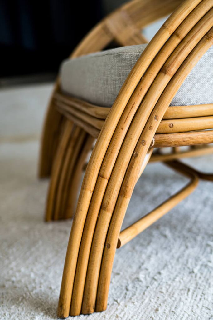 Handcrafted Sali sofa made from natural rattan with elegant flowing design and neutral tones, showcasing artisanal craftsmanship and timeless style