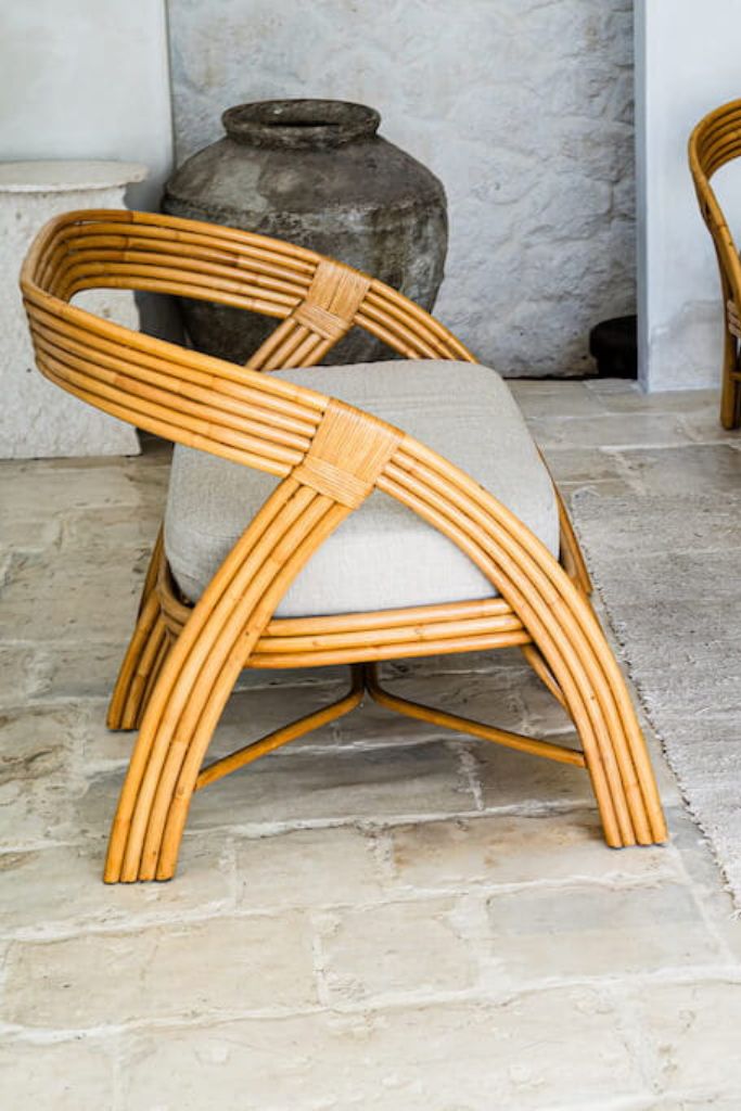 Handcrafted Sali sofa made from natural rattan with elegant flowing design and neutral tones, showcasing artisanal craftsmanship and timeless style