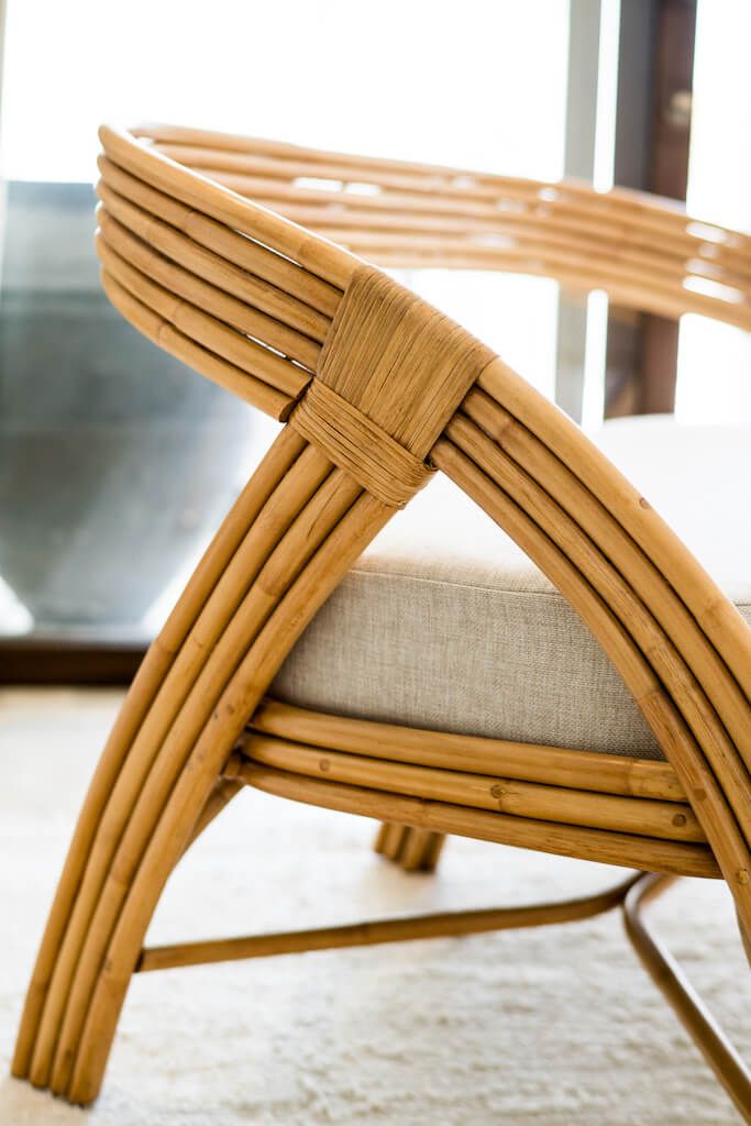 Handcrafted Sali sofa made from natural rattan with elegant flowing design and neutral tones, showcasing artisanal craftsmanship and timeless style