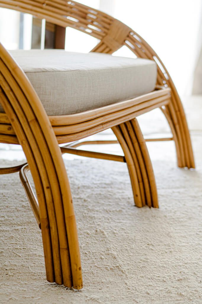 Handcrafted Sali sofa made from natural rattan with elegant flowing design and neutral tones, showcasing artisanal craftsmanship and timeless style