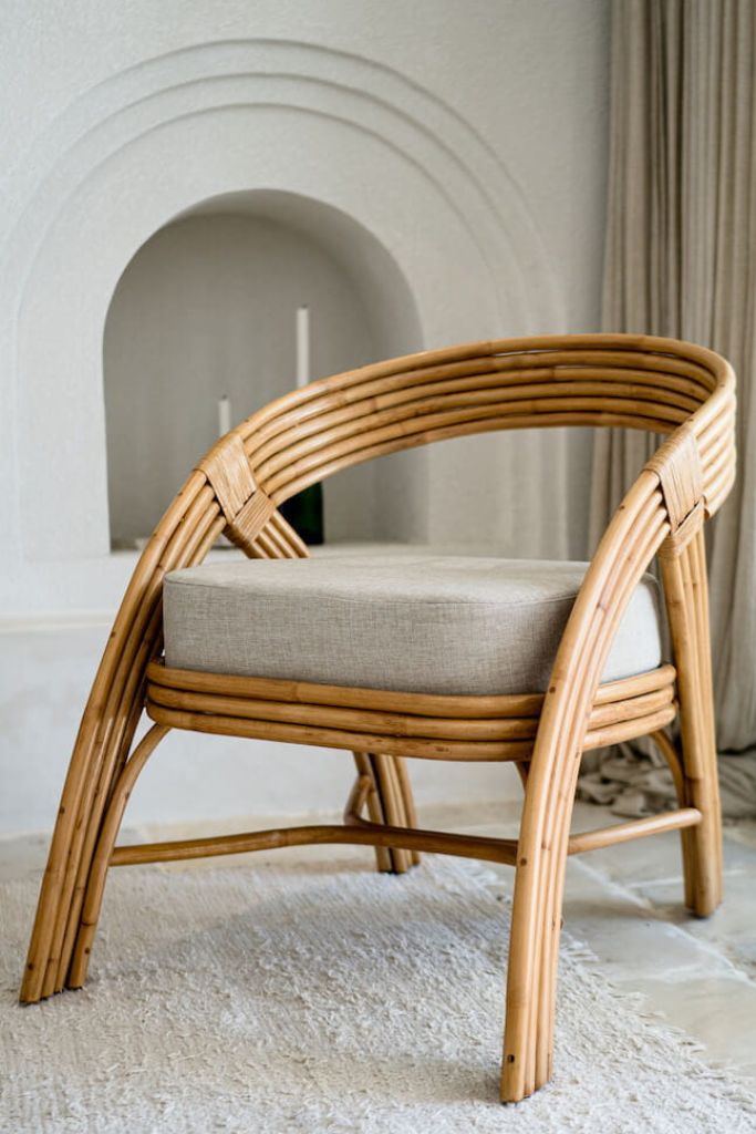 Handmade Sali rattan chair with opalescent autumn tones, cubic design, and soft seat cushion, perfect for natural and boho-inspired interiors.