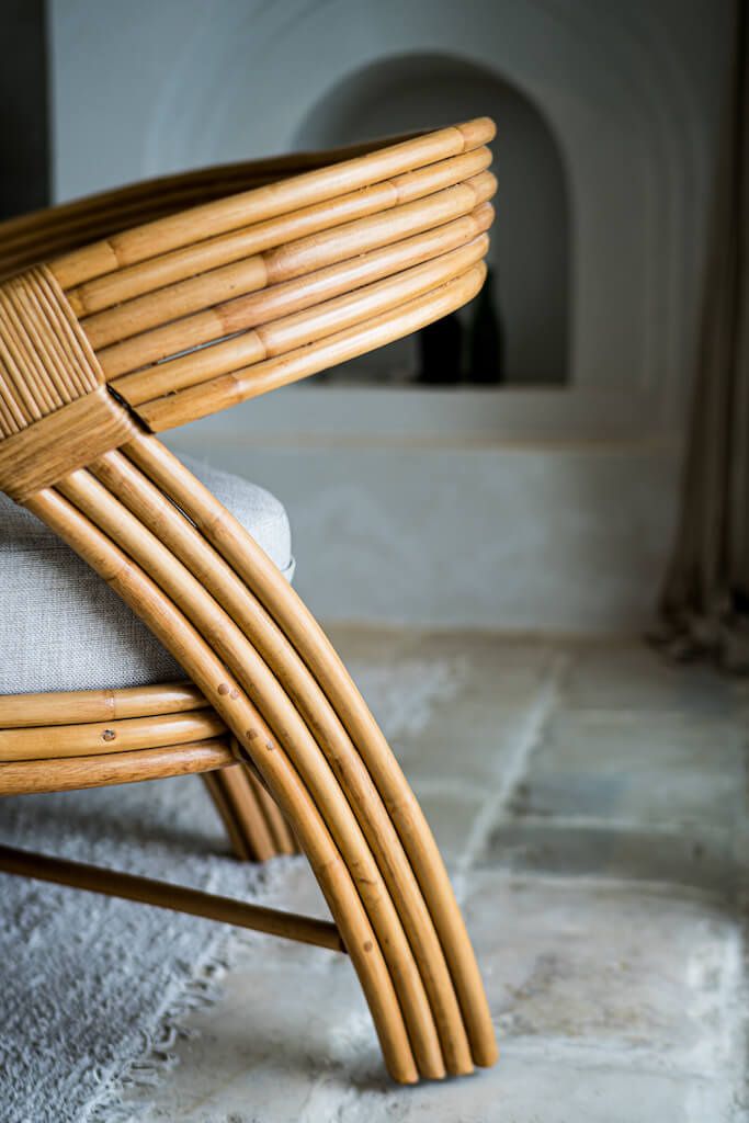 Handmade Sali rattan chair with opalescent autumn tones, cubic design, and soft seat cushion, perfect for natural and boho-inspired interiors.