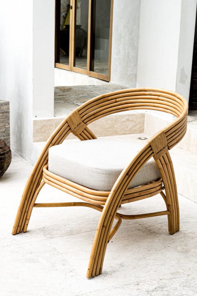 Handmade Sali rattan chair with opalescent autumn tones, cubic design, and soft seat cushion, perfect for natural and boho-inspired interiors.