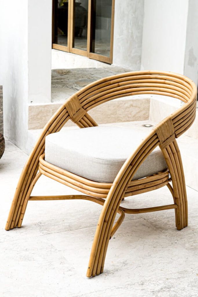 Handmade Sali rattan chair with opalescent autumn tones, cubic design, and soft seat cushion, perfect for natural and boho-inspired interiors.
