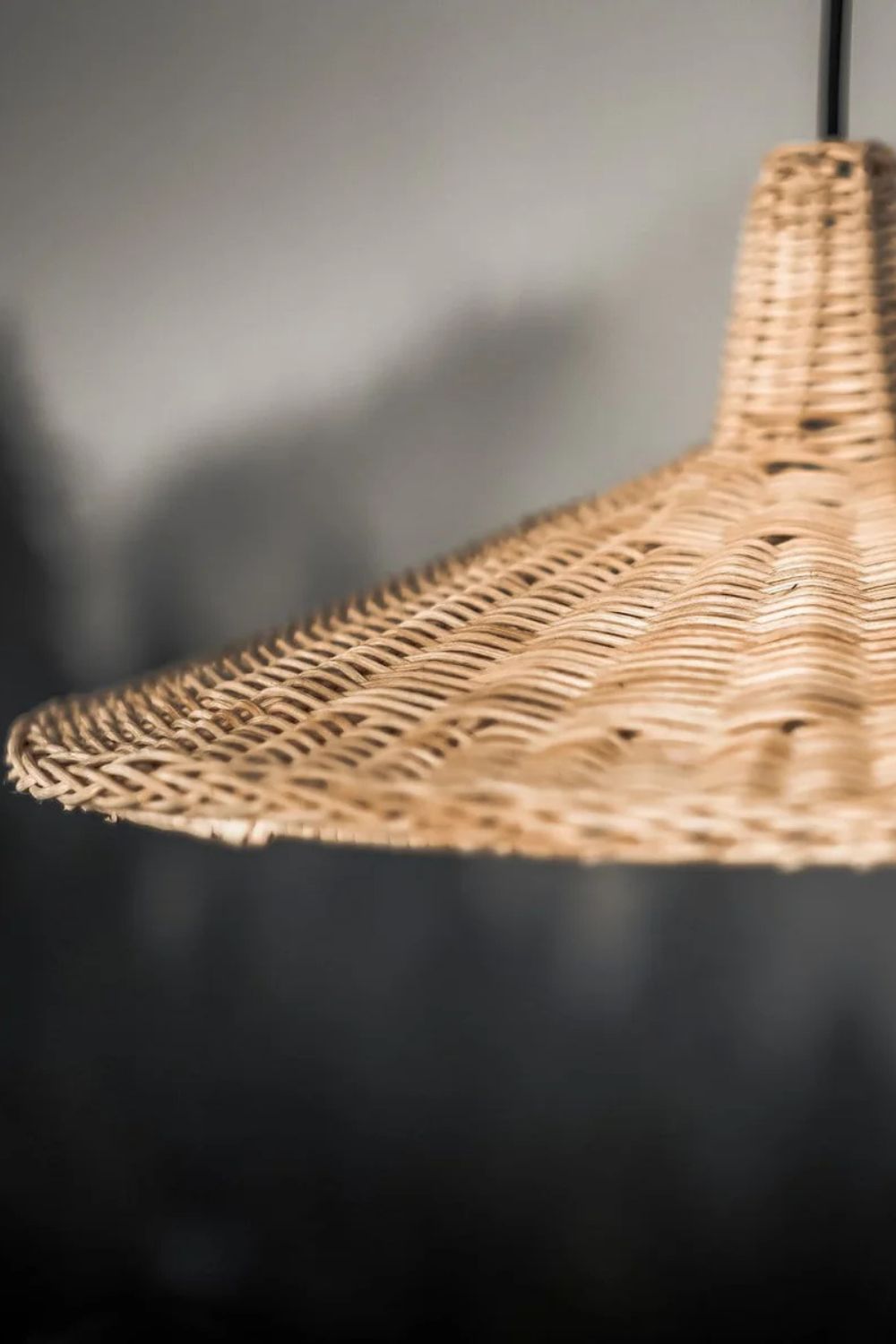 Handmade Sutter lamp in natural rattan with bohemian tropical design, perfect for stylish home décor