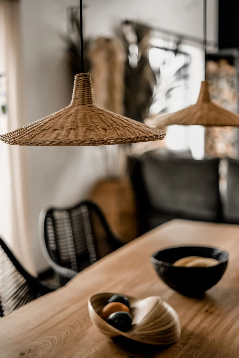 Handmade Sutter lamp in natural rattan with bohemian tropical design, perfect for stylish home décor