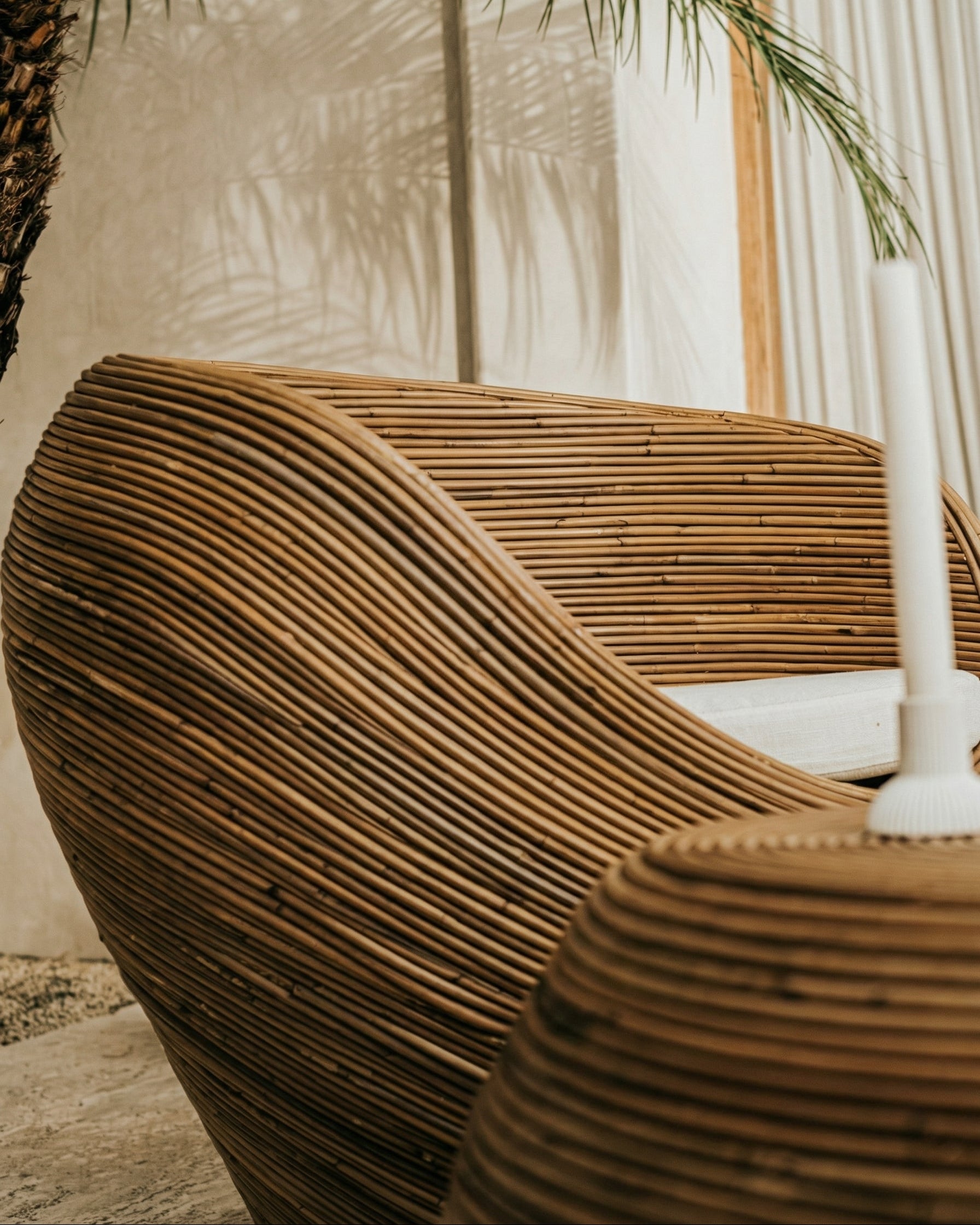 Handmade rattan armchair in dark brown with boho style, perfect for cozy living spaces