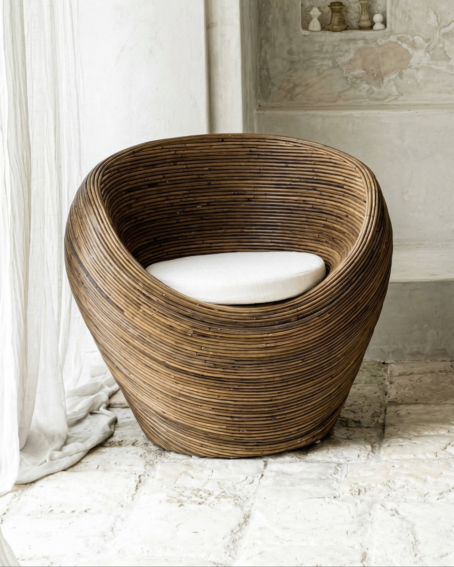 Handmade rattan armchair in dark brown with boho style, perfect for cozy living spaces