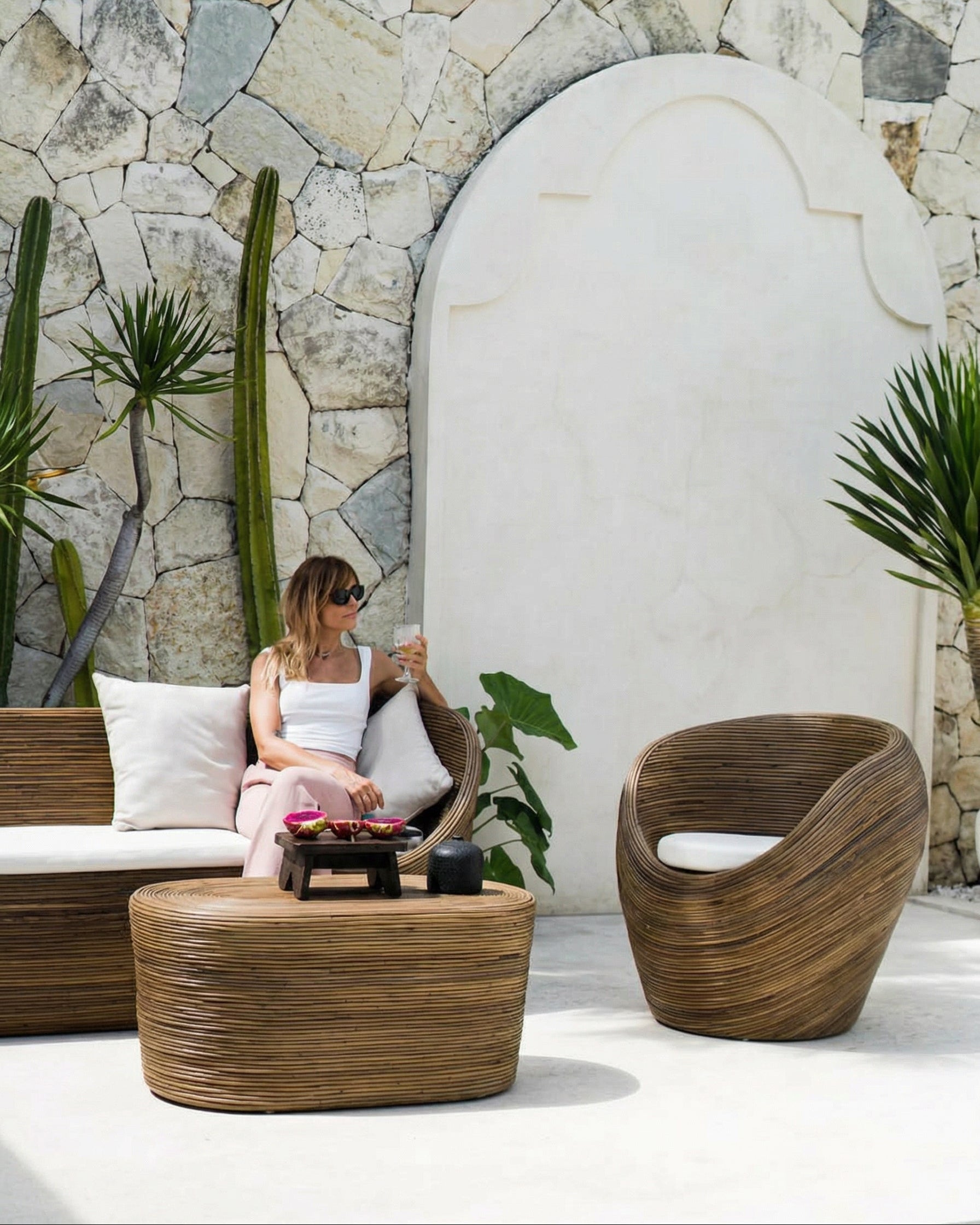 Handmade rattan armchair in dark brown with boho style, perfect for cozy living spaces
