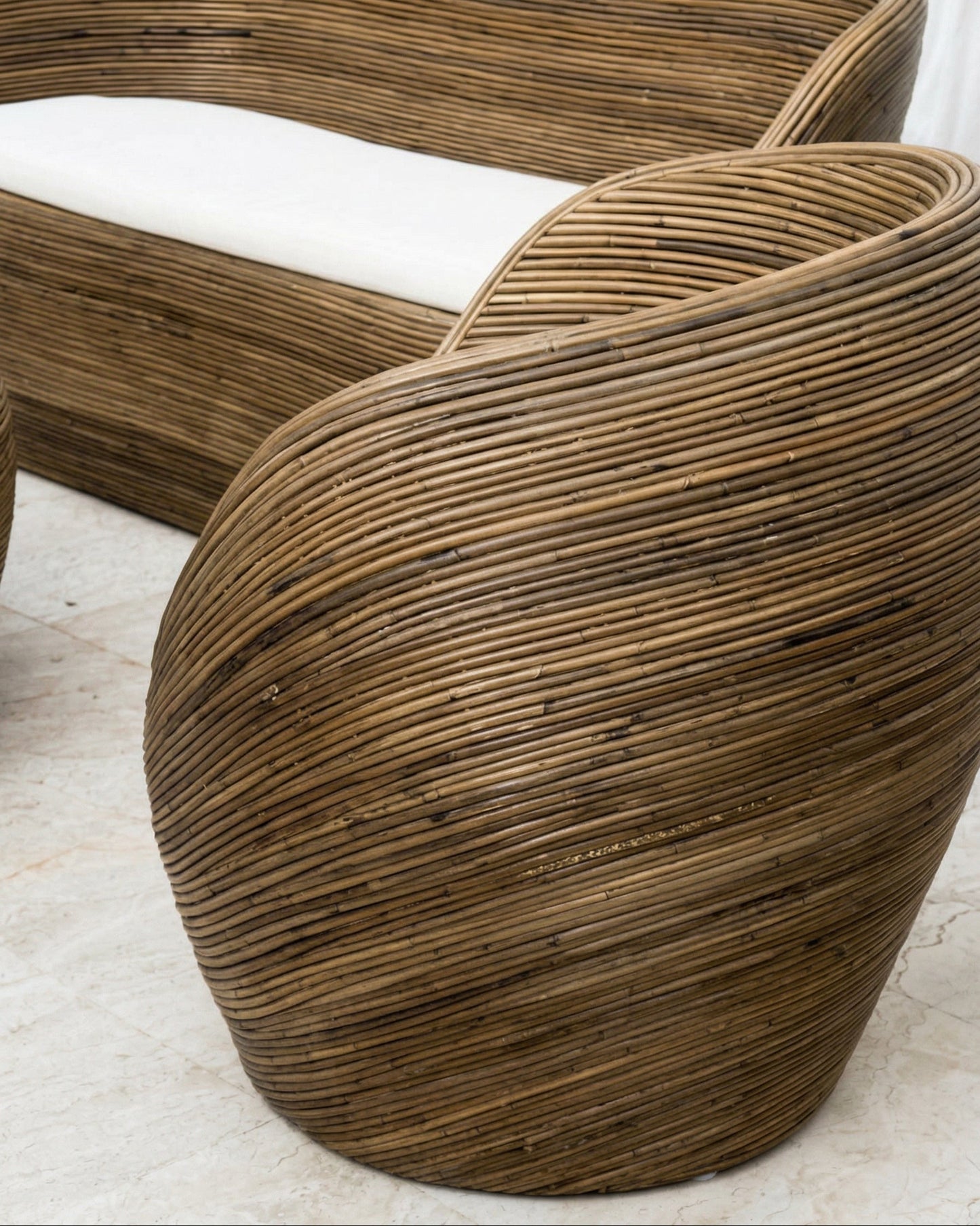 Handmade rattan armchair in dark brown with boho style, perfect for cozy living spaces