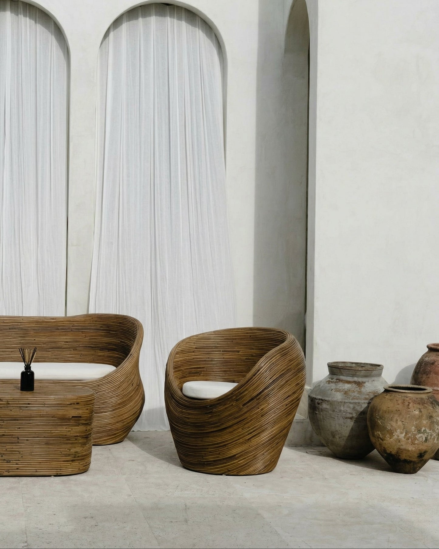 Handmade rattan armchair in dark brown with boho style, perfect for cozy living spaces