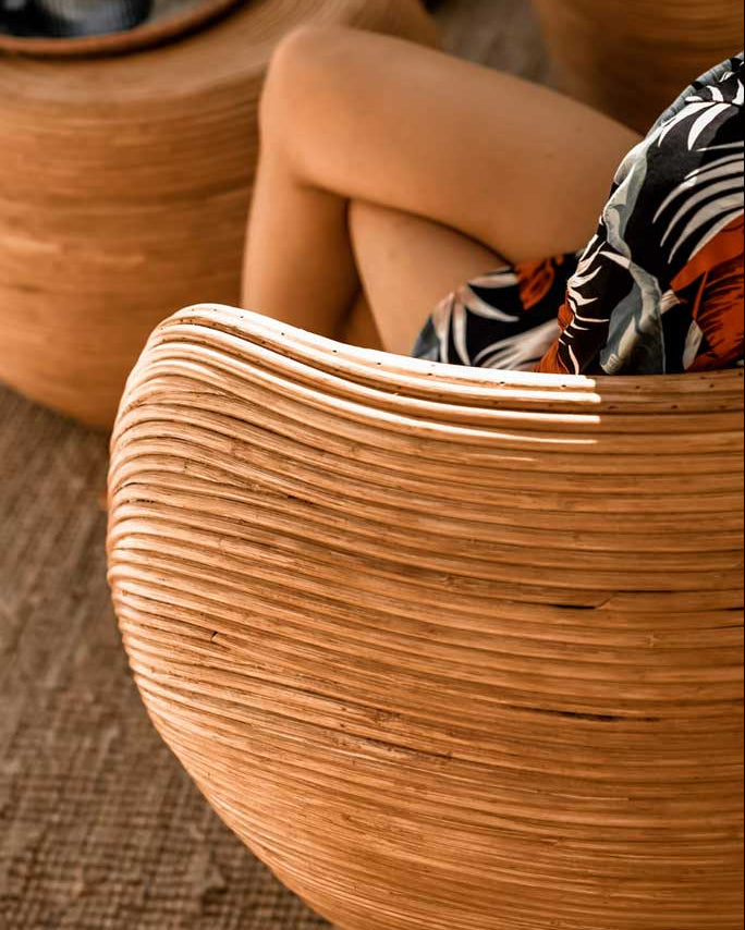 Handmade rattan armchair in cognac brown with boho style, perfect for cozy living spaces