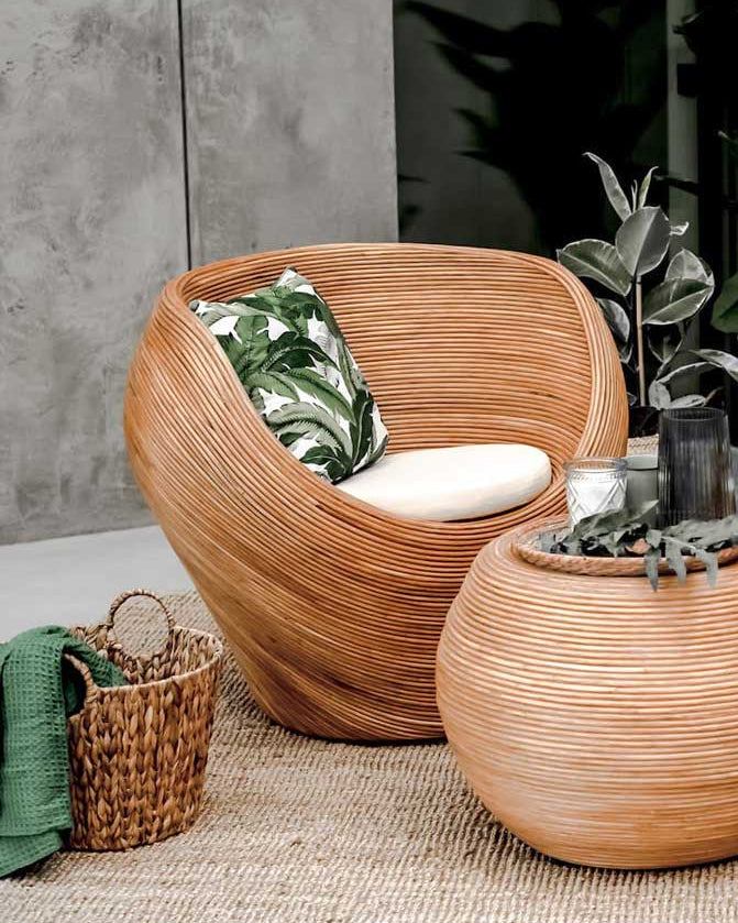 Handmade rattan armchair in cognac brown with boho style, perfect for cozy living spaces