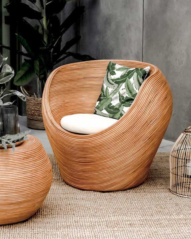 Handmade rattan armchair in cognac brown with boho style, perfect for cozy living spaces