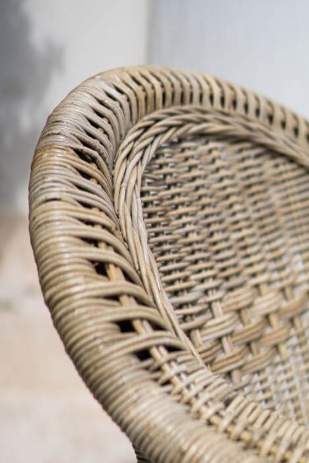 Tyo two-seater light brown rattan sofa with curved armrests